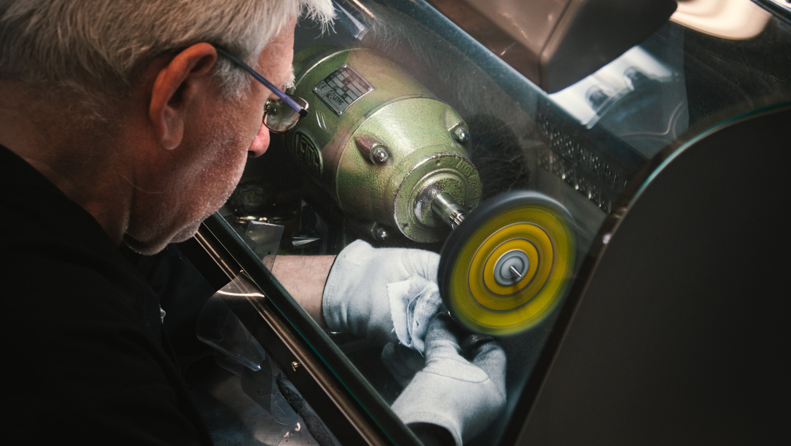 Master jeweller inspecting a diamond setting — Polishing