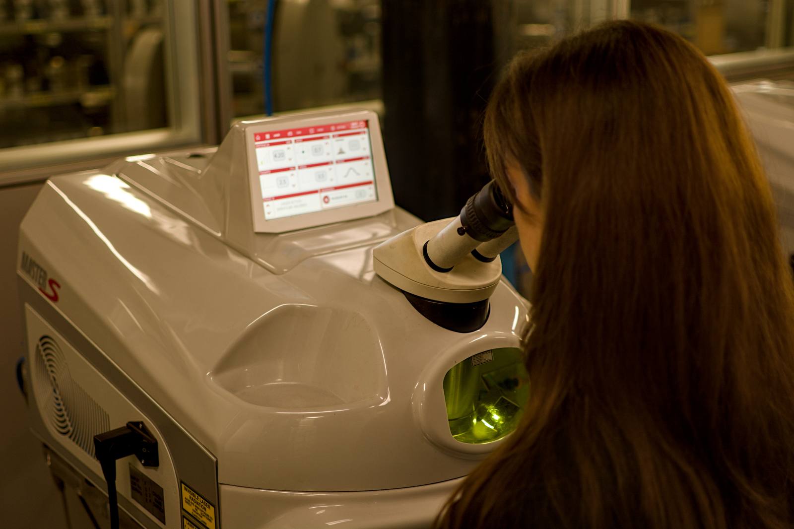 Master jeweller inspecting a diamond setting — Laser welding